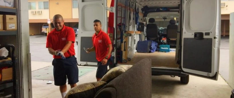 Reddy Van team performing junk removal Tampa service, loading unwanted furniture into the moving van.