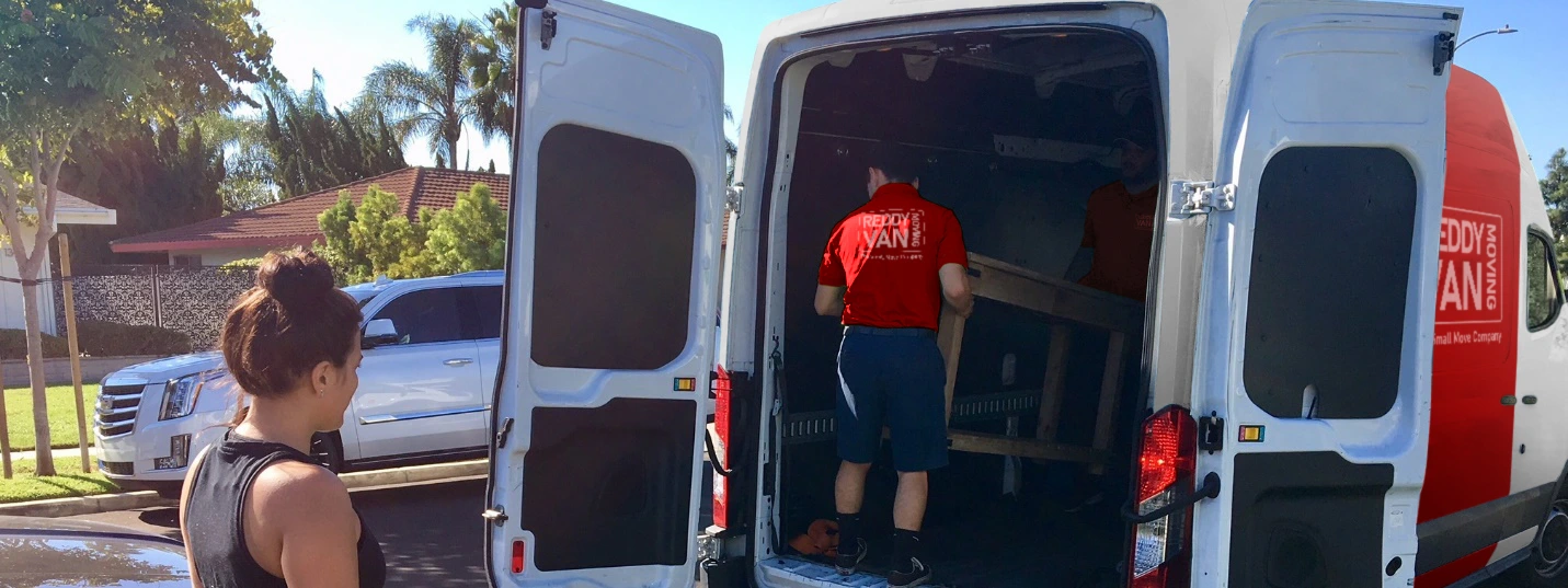 Professional junk removal Tampa service by Reddy Van, helping a customer clear out old items and furniture.